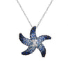 This unique, contemporary 14k white gold starfish pendant features different shades of glimmering blue sapphires and white diamonds.